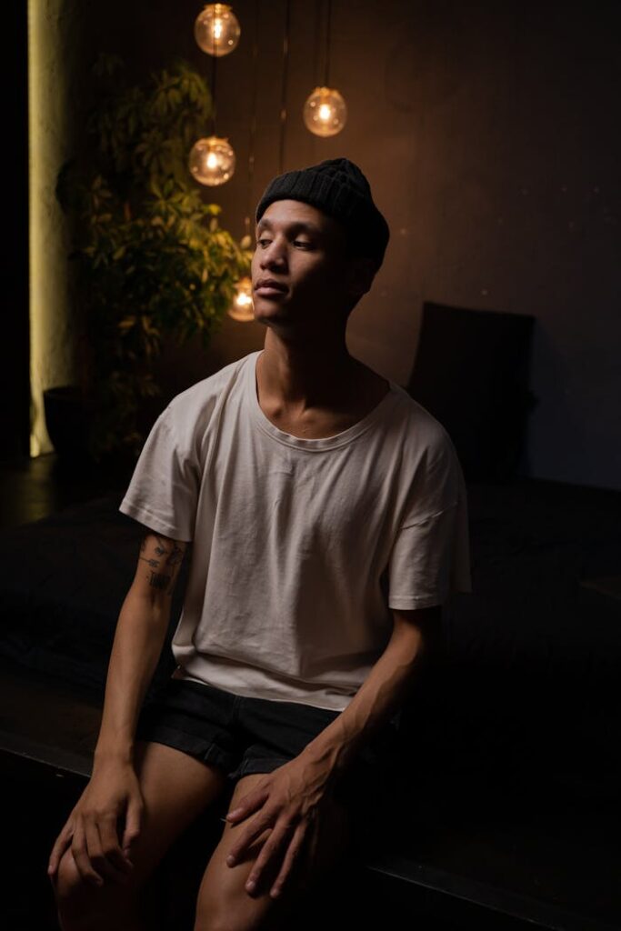 Man in White Crew Neck T-shirt and Black Shorts Wearing a Beanie